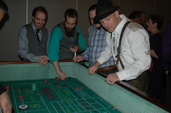 People having fun at a craps table party in Baltimore
