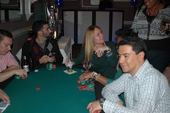 People having fun at a poker table party in Baltimore